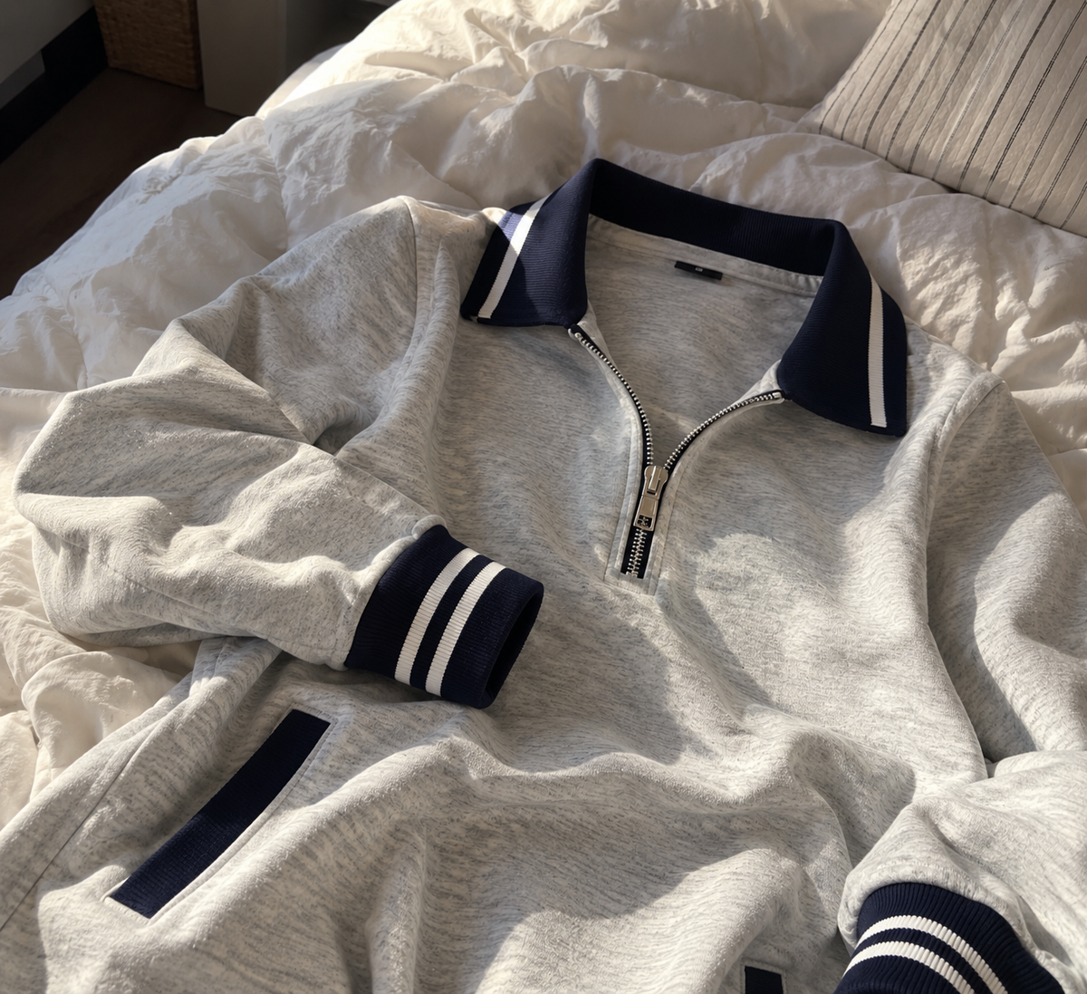 The reason it doesn’t feel like “just another casual dress” — that collar, the little zip and those beautifully finished striped edges.